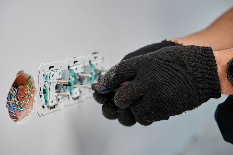 Electrician Working on Outlet